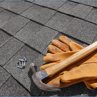image of hammer, gloves, roofing nails, on top of roof